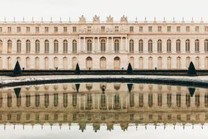 Versailles France sculptures in the courtyard of the castle, facade architecture. photo