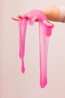 a toy for children mucus and liquid flowing on hand photo
