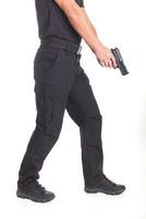 A man in military uniform with a pistol in his hands on a white background photo