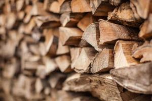 beautifully stacked firewood, natural wood for burning in the furnace photo