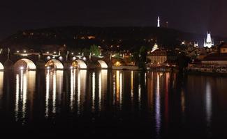 night bridge over the river with lanterns in Prague, Czech Republic. photo