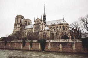 Paris, France, Notre Dame de Paris facade, city panorama with river view. photo