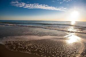 sunset on the sea beautiful waves photo