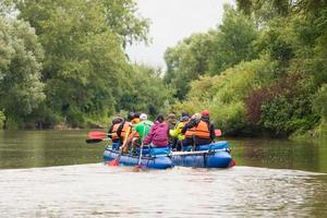 competition of teams on catamarans on the river, rafting photo