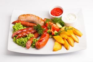 beautiful photo close-up menu of potatoes, sausage salad on a plate on a white background