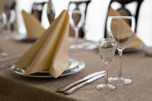 empty goblets and other cutlery are served on the festive table. photo