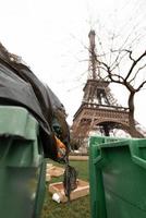 Paris, Eiffel Tower with garbage cans in front. photo