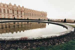 Versailles France sculptures in the courtyard of the castle, facade architecture. photo