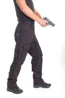 A man in military uniform with a pistol in his hands on a white background photo