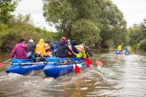 competition of teams on catamarans on the river, rafting photo