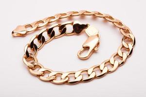 close-up gold bracelet jewelry, chain on hand photo