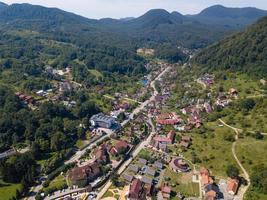 city in the middle of the mountains from a drone photo