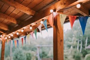 the house is decorated with flags and lights for the party. photo