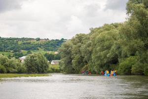 competition of teams on catamarans on the river, rafting photo