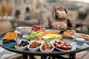 traditional Turkish table with sliced vegetables and fruits. photo