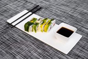 a dish of delicious sushi rolls photo