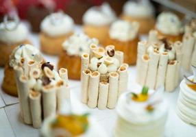 various delicious sweet pastries in the shop window. photo