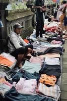 Badung, Bali - January 13 2023 Photo of a seller and a buyer doing a bargain and a transaction between them.