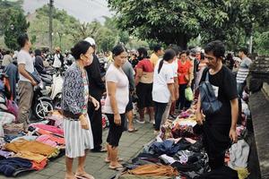 Badung, Bali - January 13 2023 Photo of a seller and a buyer doing a bargain and a transaction between them.