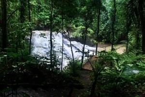 The beauty of a very natural waterfall scenery named Goa Rang Reng waterfall located in Gianyar Bali. photo