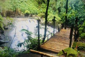 The beauty of a very natural waterfall scenery named Goa Rang Reng waterfall located in Gianyar Bali. photo