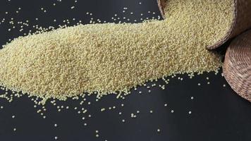 Heap of millet isolated on black background video