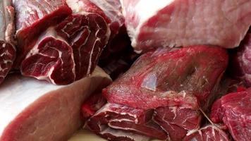 Different types of raw pork meat and beef. Raw meat on wooden table. video