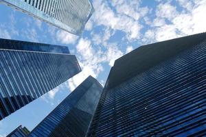 low angle view of singapore city buildings. photo