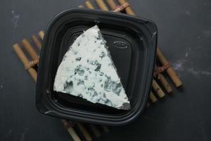detail shot of blue cheese on table photo