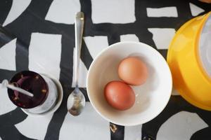 overhead view of half boil eggs in a bowl. photo