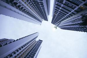 low angle view of singapore city buildings. photo