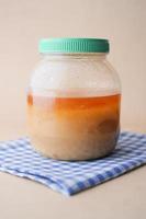 homemade ghee in container on a table , photo