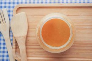 top view of homemade ghee in container on a table , photo