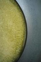 vertical shot of homemade ghee in container on a table , photo