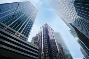 low angle view of singapore city buildings. photo