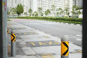 Señal de tráfico de taxis en la ciudad de Singapur foto