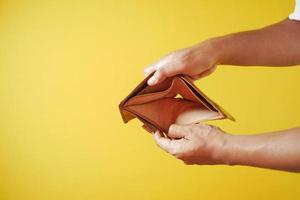 Man hand open an empty wallet with copy space. photo