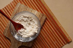 top view of milk cream in a container on table photo