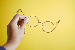 men holding a Old eyeglass photo