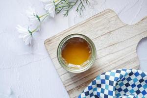 homemade ghee in container on a table , photo