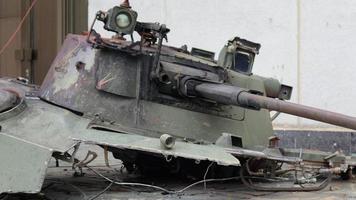 War in Ukraine. Destroyed tank with torn off turret. Broken and burned military tanks. Designation of a sign or symbol in white paint on the tank. Destroyed military equipment. War against Ukraine. video
