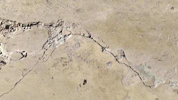 Road surfaces from cracked cement or damaged by earthquakes or prolonged use.