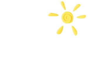 Plasticine sun, white isolated background. Kids play background. Copy space. photo