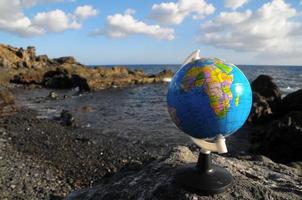 Globe on the beach photo