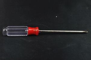 Screwdriver on black background photo