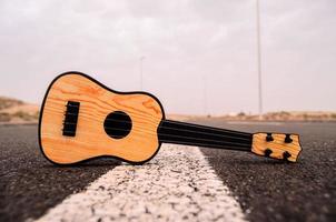 Acoustic guitar on the road photo