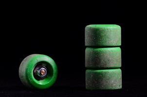 Skateboard wheels on black background photo