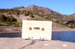 Cassette tape on a rock photo