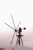 Traditional windmill under clear blue sky photo