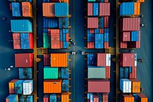 Aerial view of shipping container port terminal. Colourful pattern of containers in harbor. Maritime logistics global import export trade transportation photo
